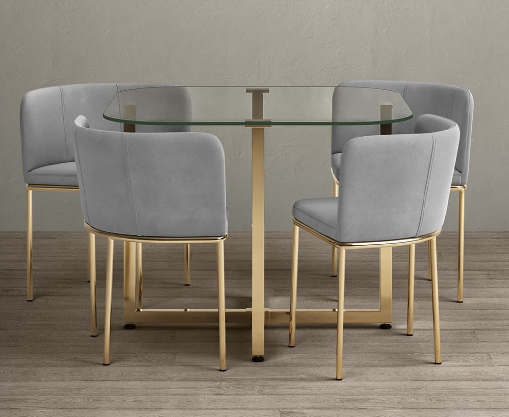 Rhodes Clear Glass Gold Leg Dining Table with 4 Grey Rhodes Chairs