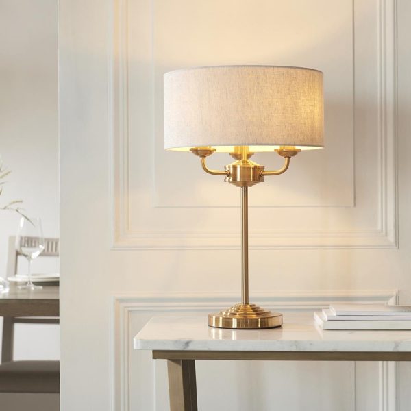 Hixson 3 Light Natural Fabric Table Lamp In Vintage Brass | Bed Sava