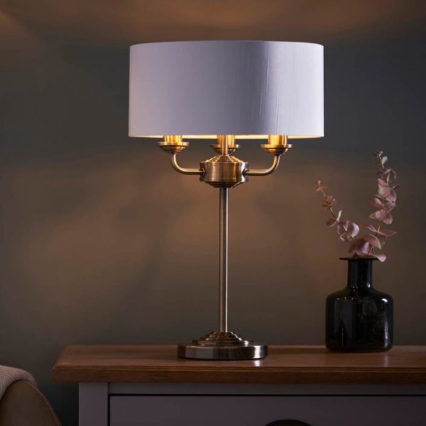 Hixson 3 Light White Fabric Table Lamp In Antique Brass | Bed Sava